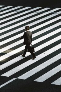 Man crossing the street looking for therapy for trauma near me
