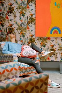 A woman relaxing on a couch after her appointment at cognitive behavioral therapy near me