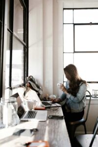 A woman at work on a computer doing online cbt therapy port jefferson, new york