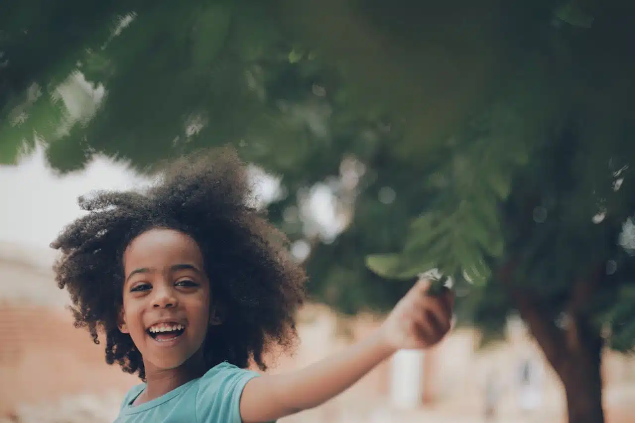 Young child outdoors symbolizing growth, resilience, and recovery from childhood trauma with CBT therapy