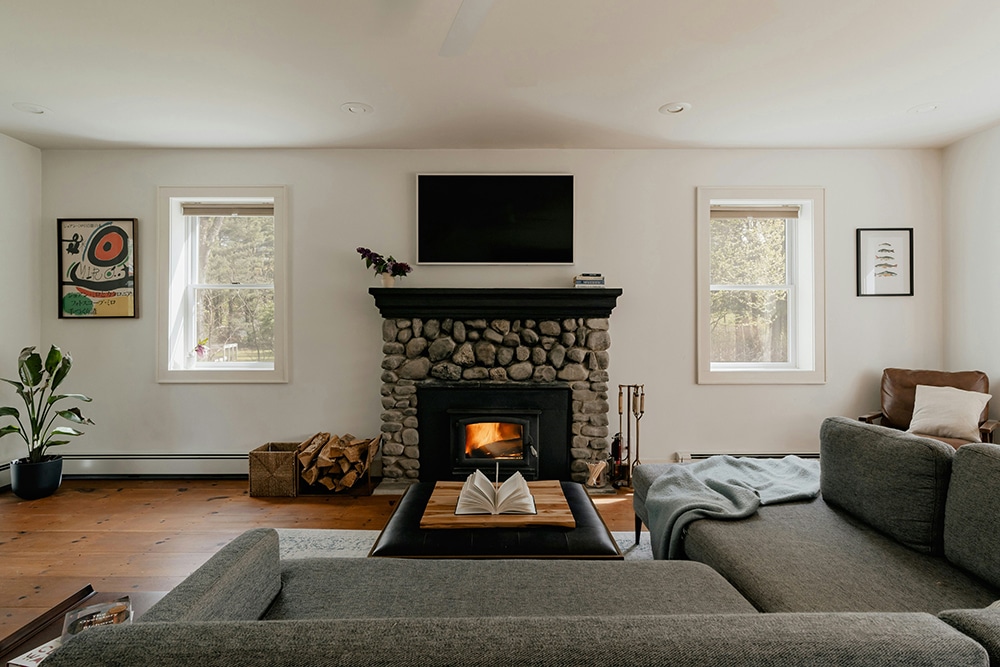 A living room with a fireplace and couches