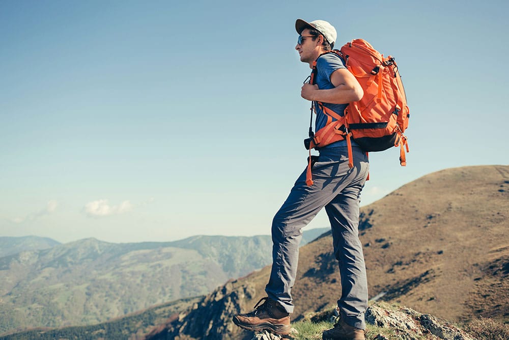 Backpacker posing in the mountains