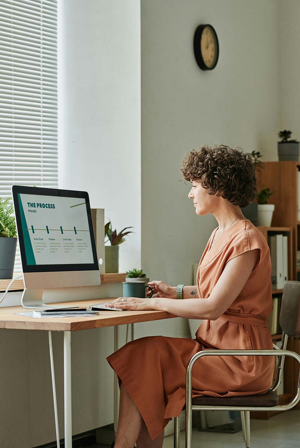 Young businesswoman sitting at her workplace